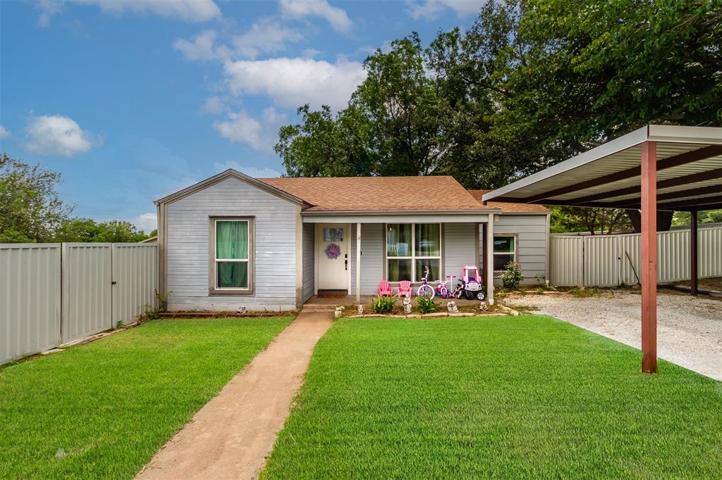 a front view of a house with a yard and porch