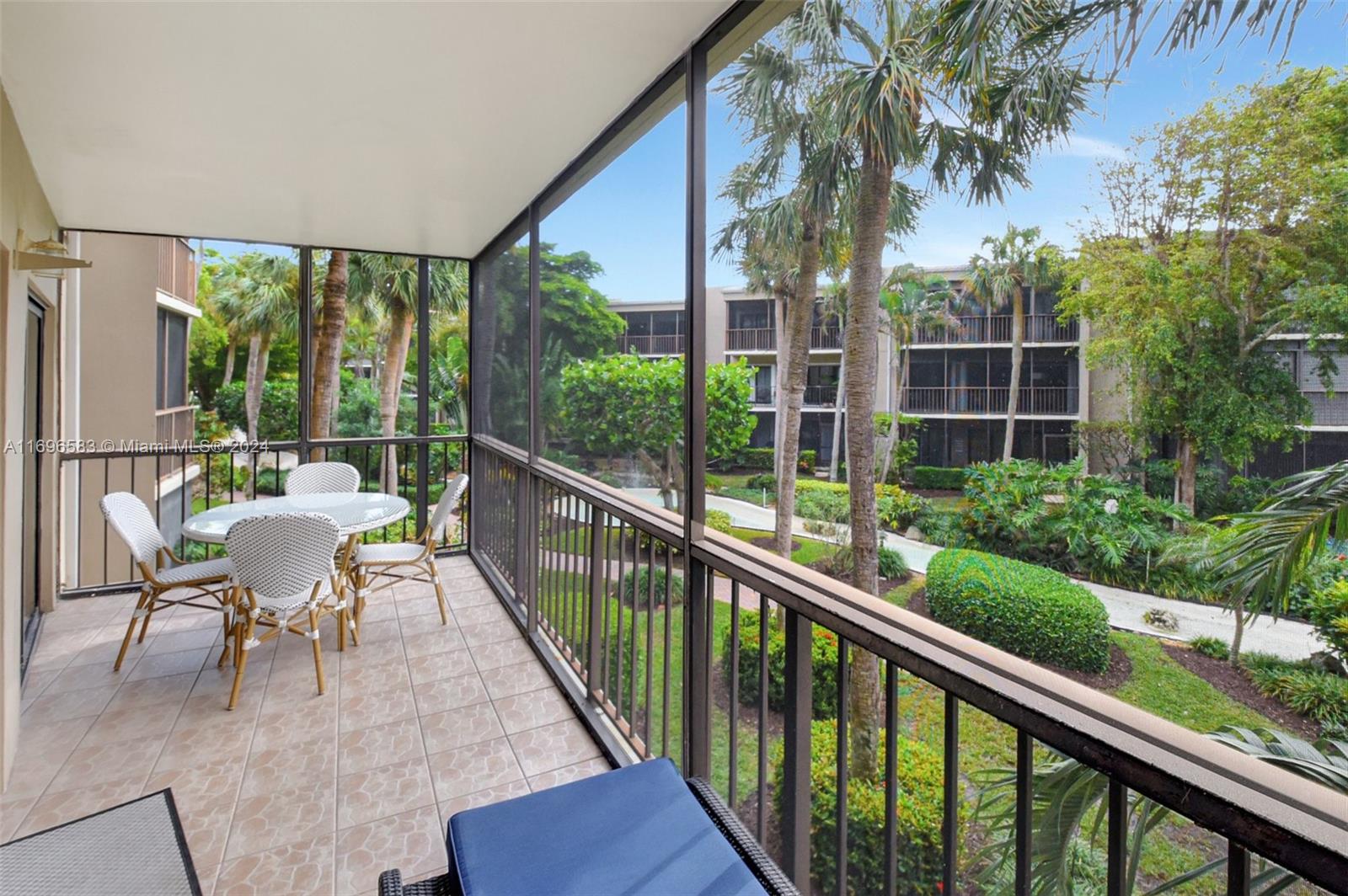 a view of a chair and tables in the balcony