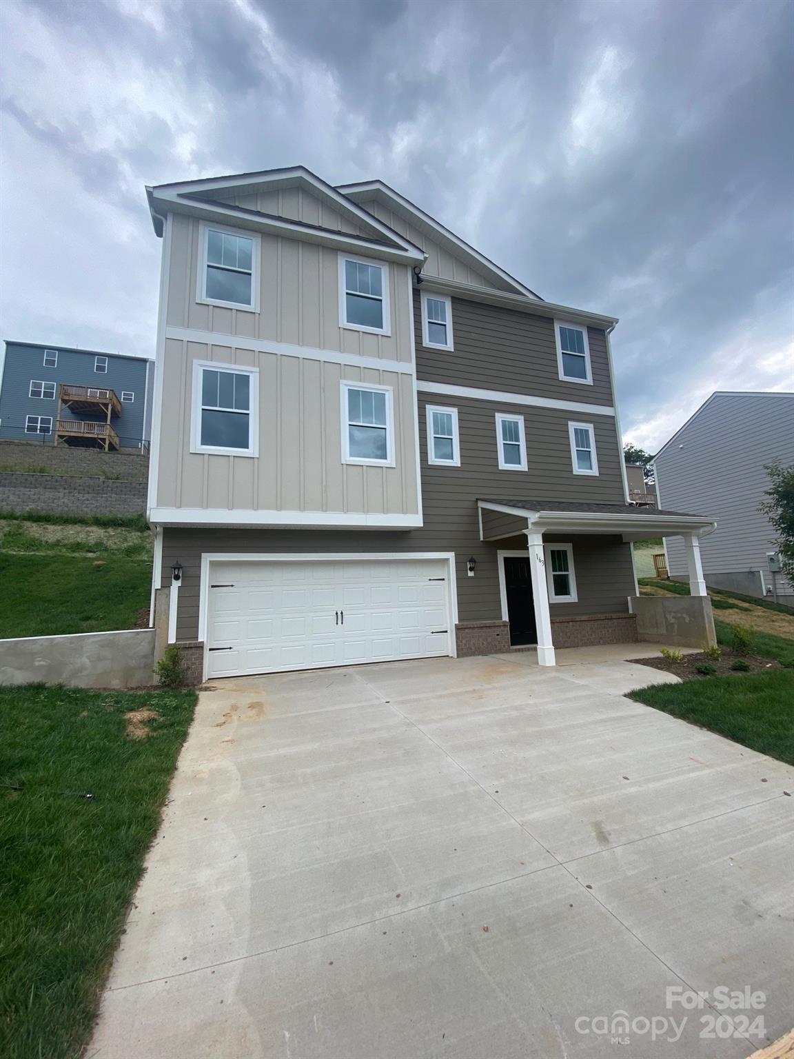 a front view of a house with a yard