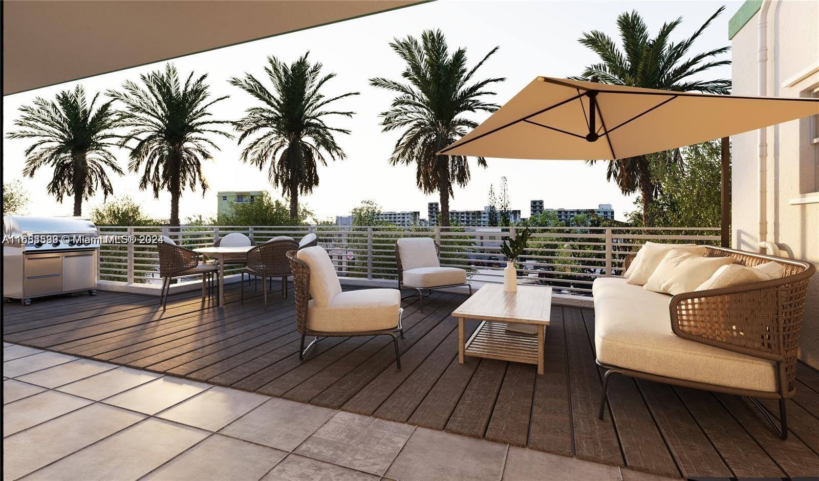 an outdoor sitting area with furniture and wooden floor