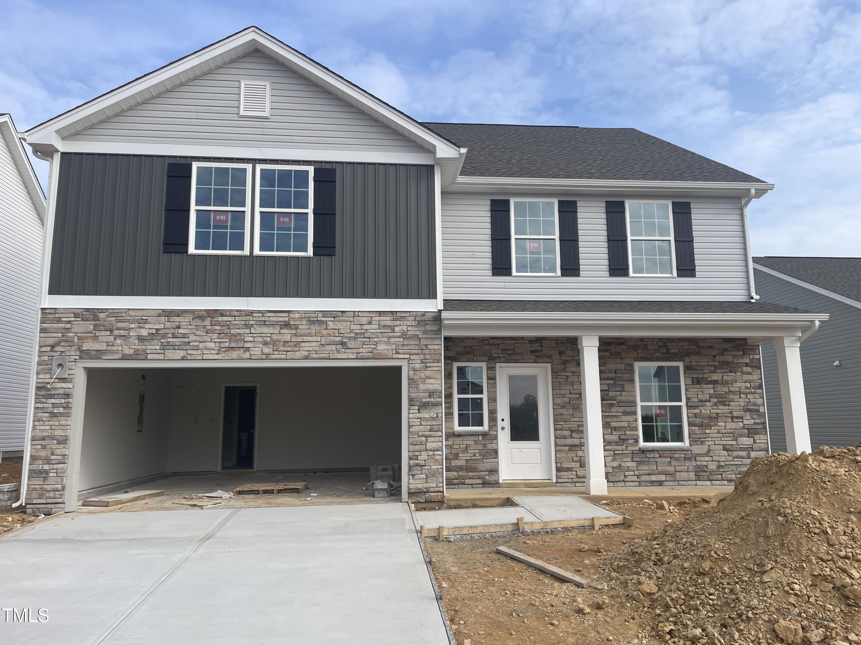 a front view of a house with a garage