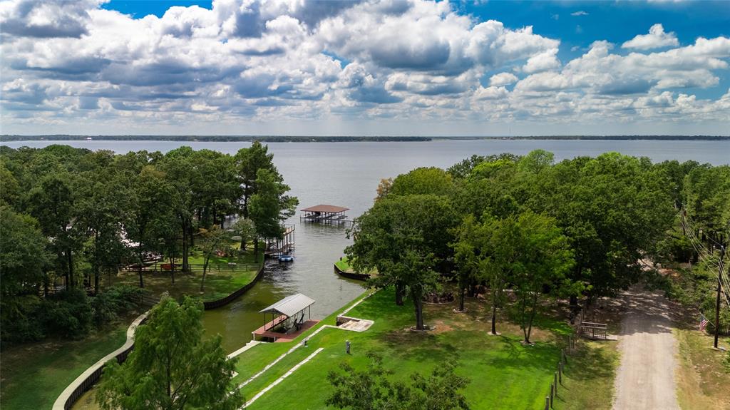 a view of a lake with a yard