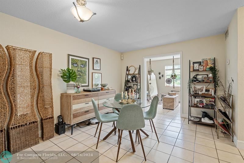 a dining room with furniture and chandelier