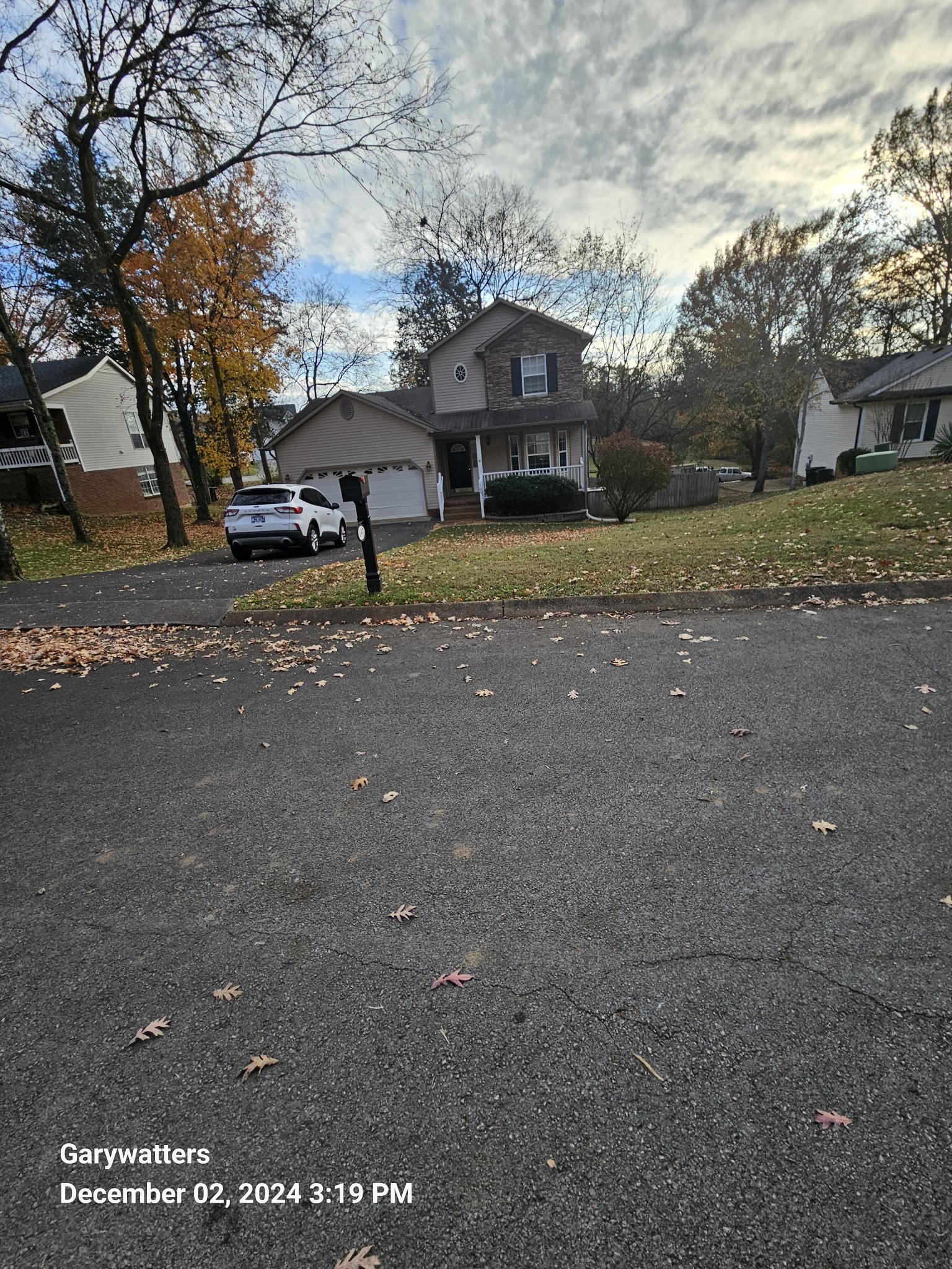 a view of street with parked cars