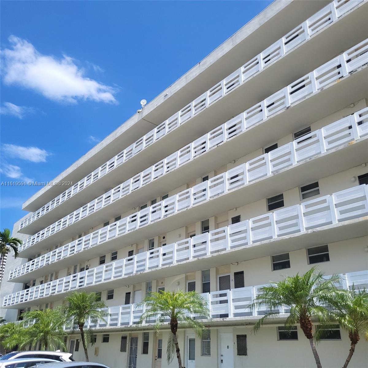 a front view of building with balcony