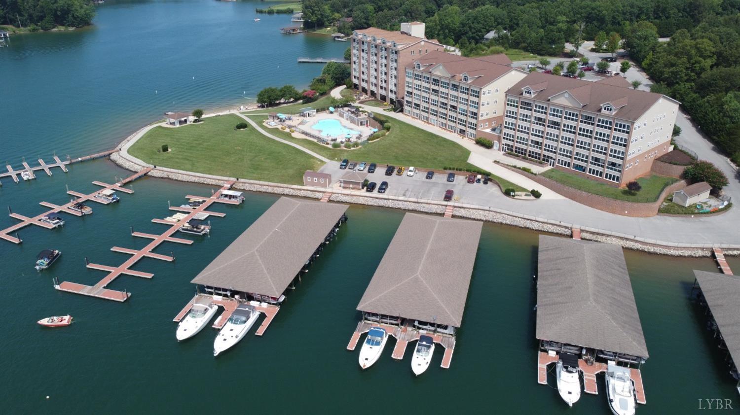 an aerial view of a house swimming pool a patio patio and outdoor seating