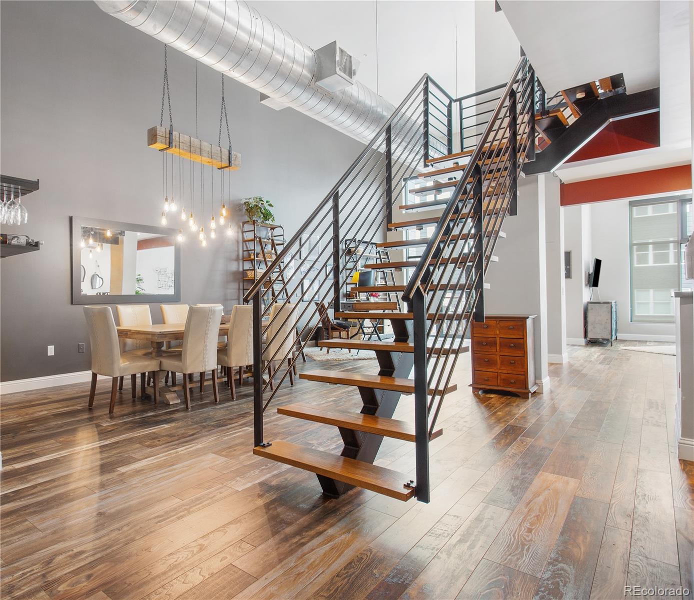 a view of entryway dining room and hall with wooden floor