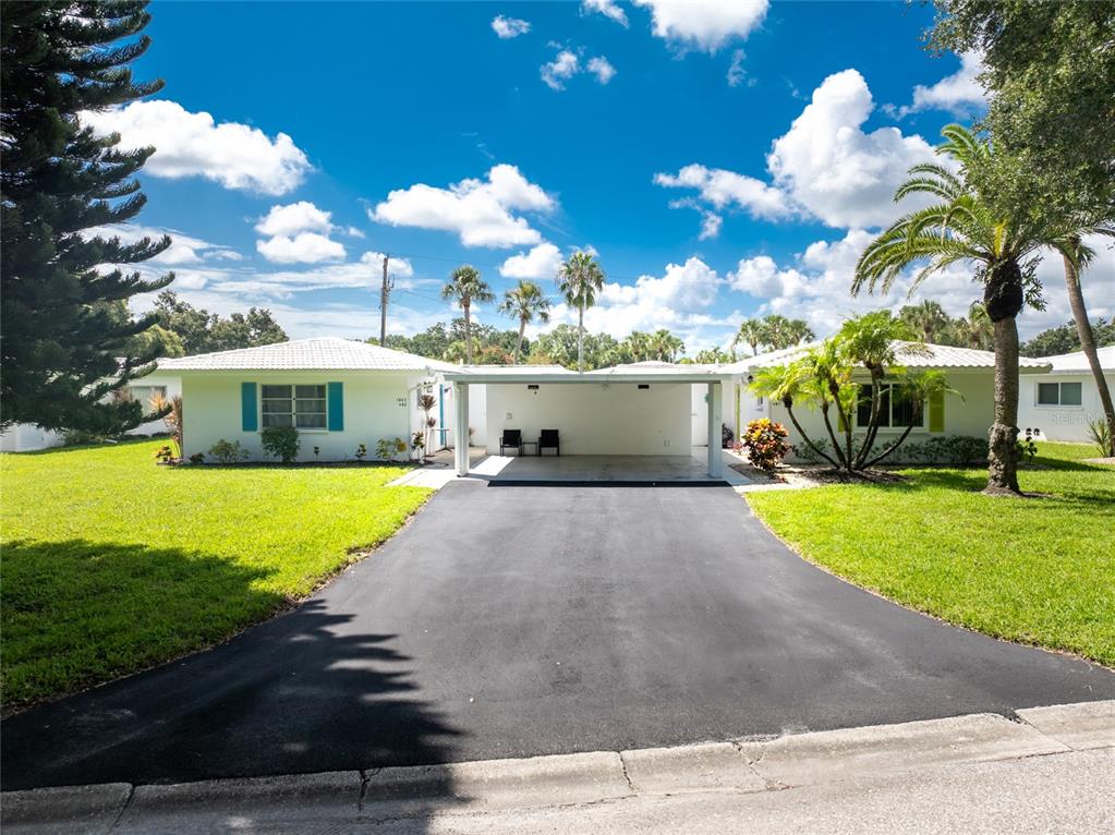 a view of a house with a yard