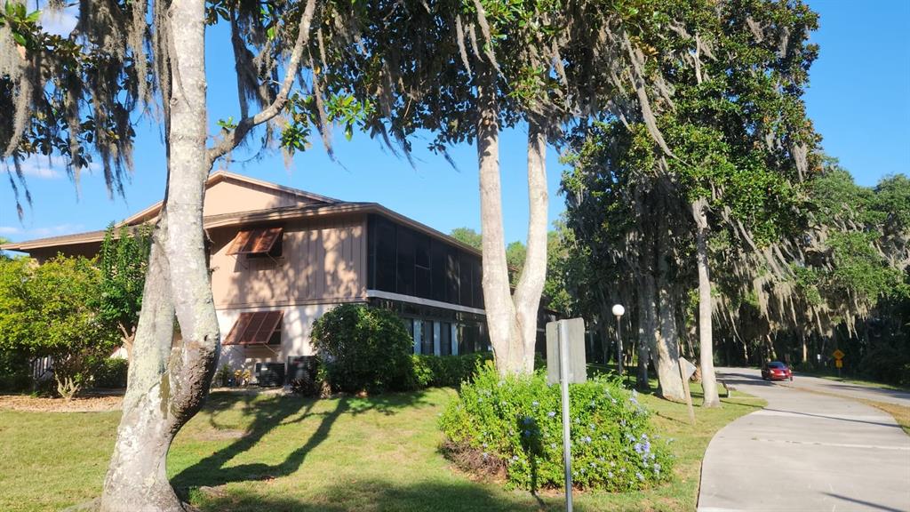 a view of a house with a yard