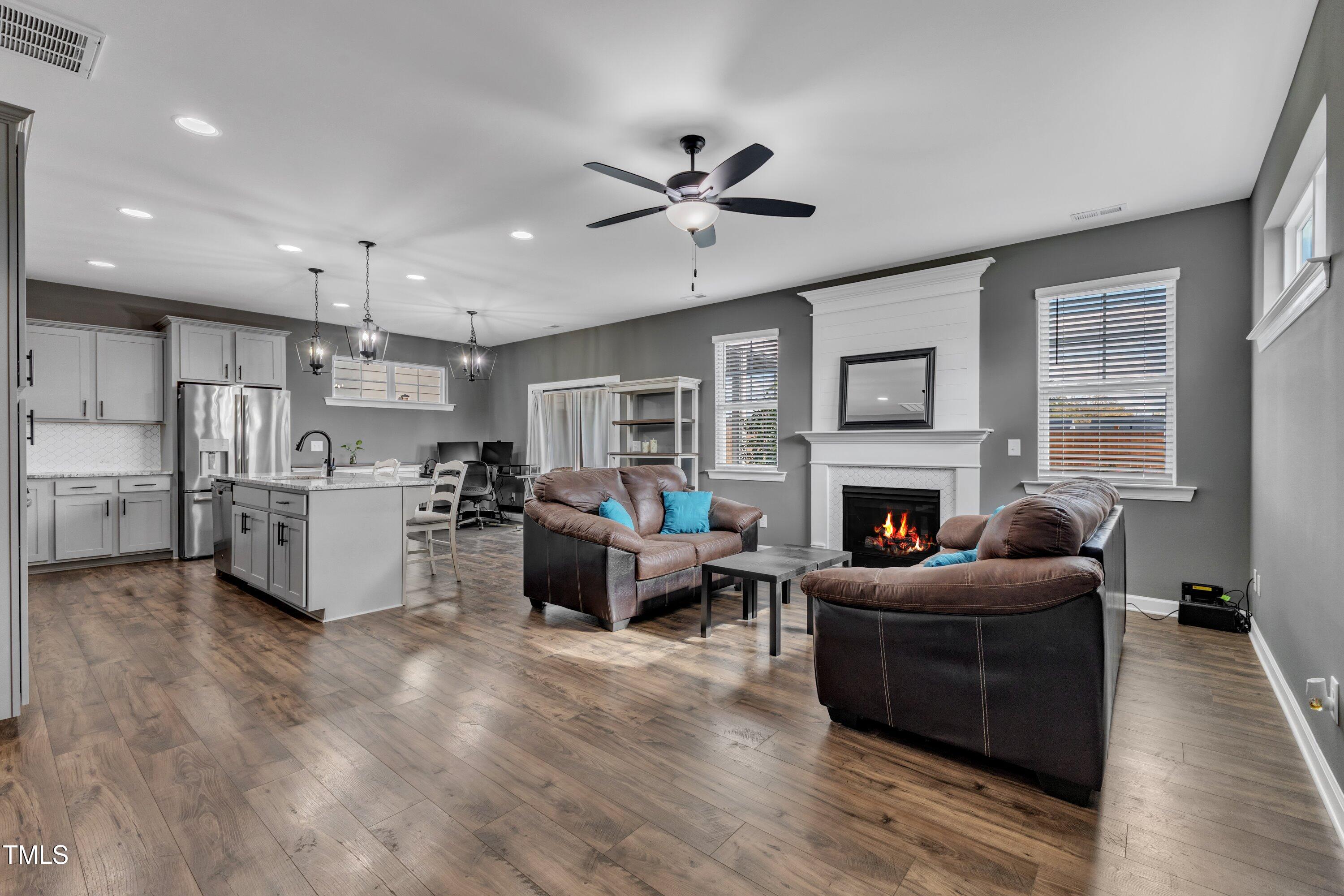 a living room with furniture and a fireplace