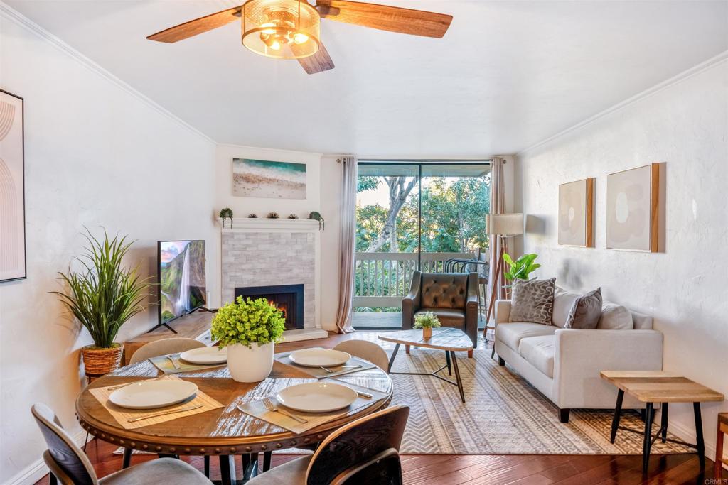 a view of a dining room with furniture window and wooden floor