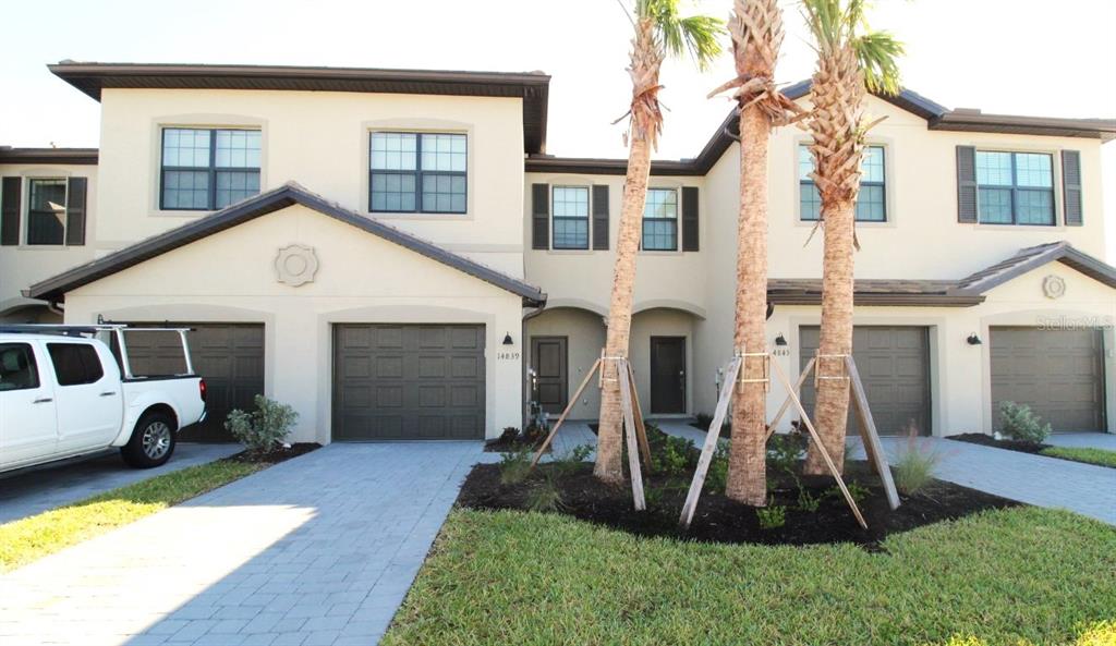 a front view of a house with a yard