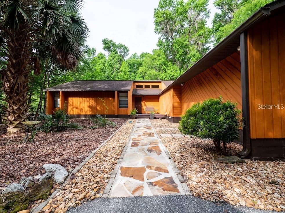 a backyard of a house with lots of green space