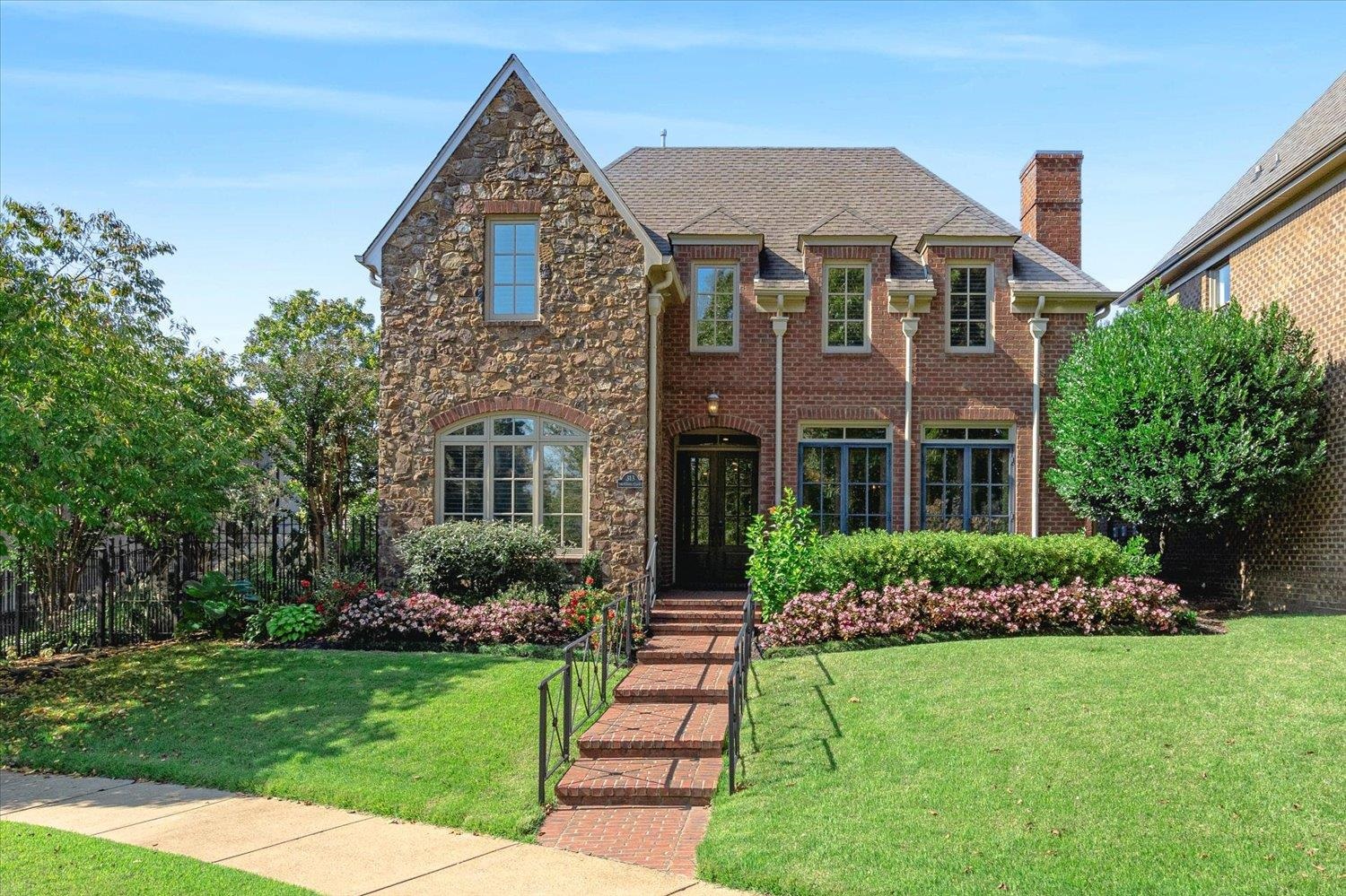 a front view of a house with a yard