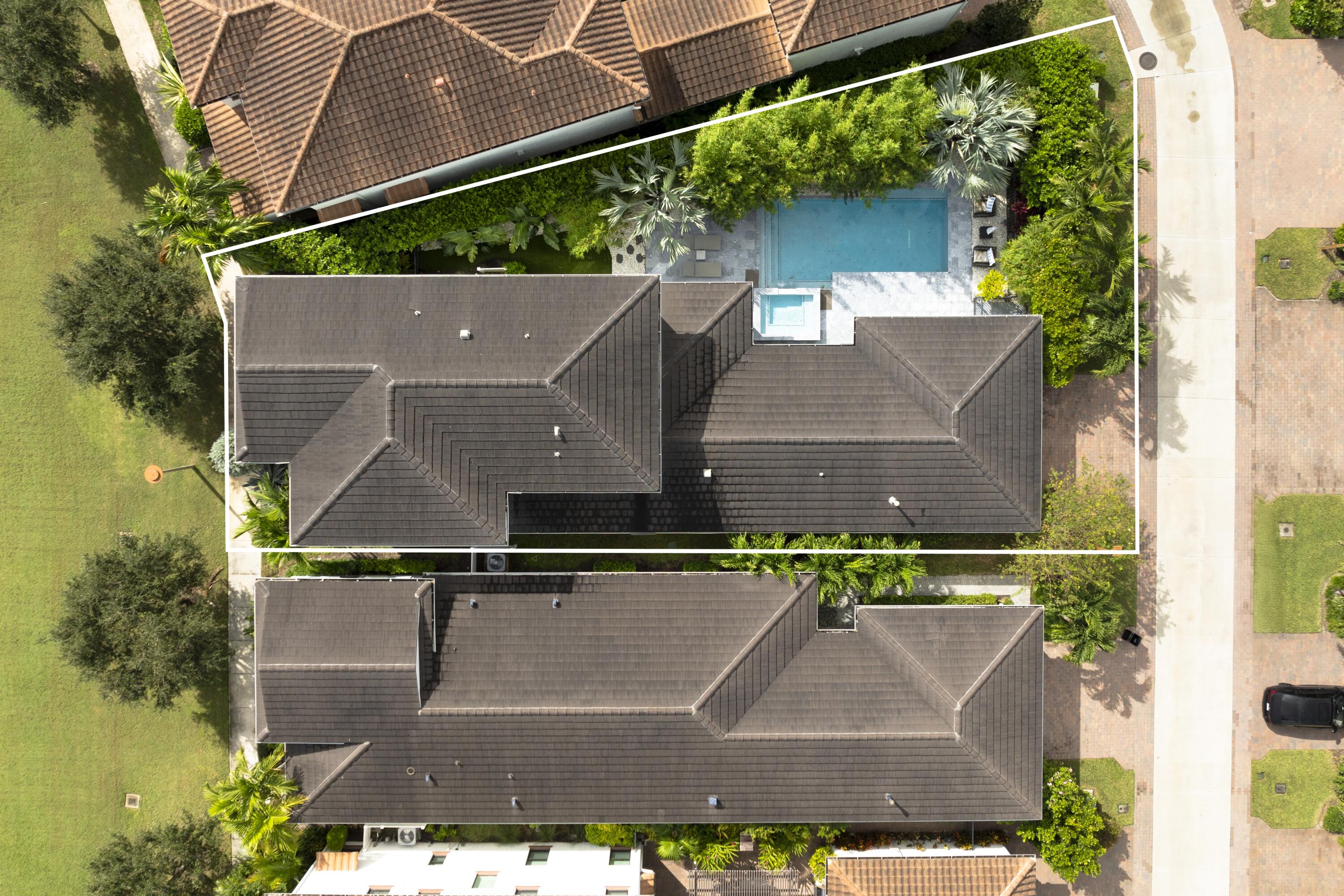 an aerial view of house with a yard