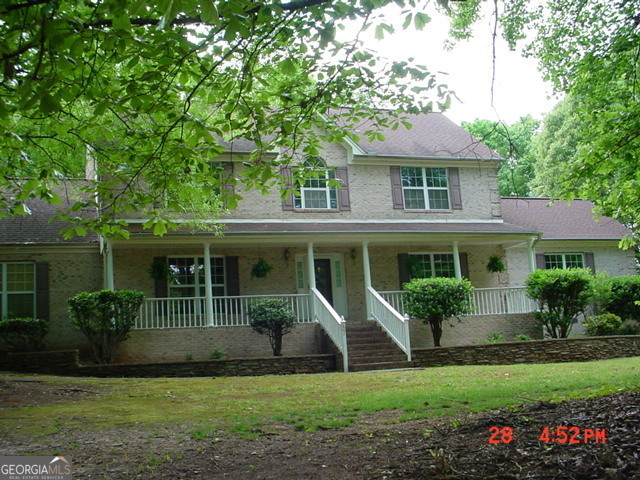 a view of a house with a garden