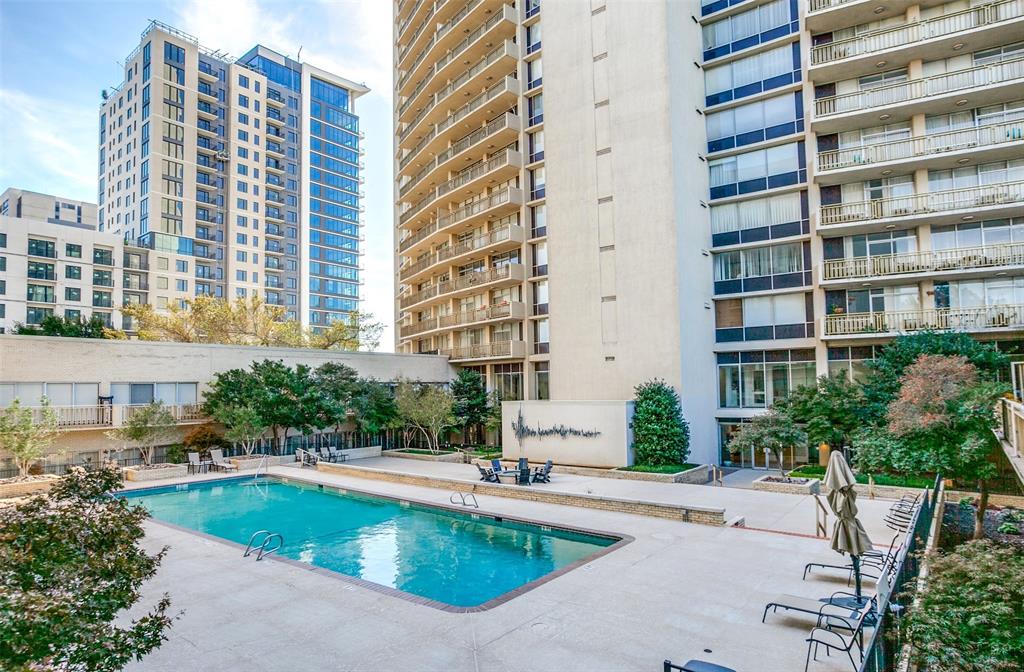 a swimming pool with outdoor seating and yard