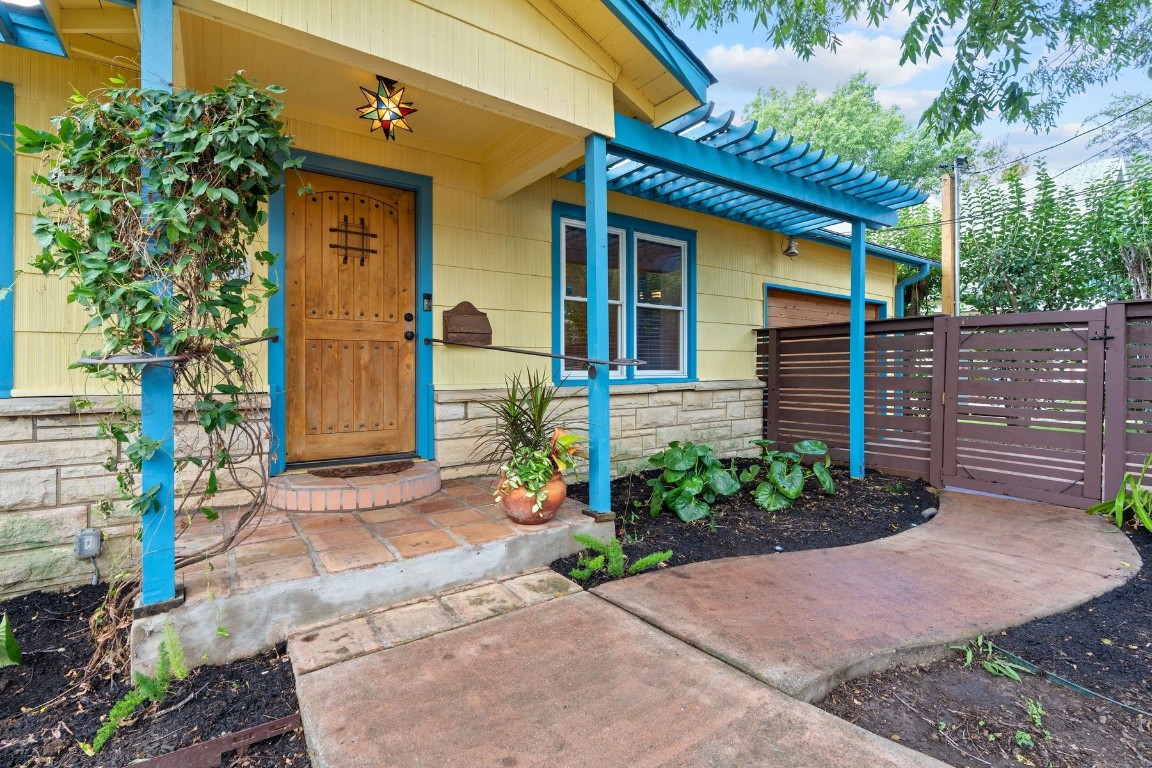 A charming and inviting entry leads to the covered porch, offering a warm welcome to the home.