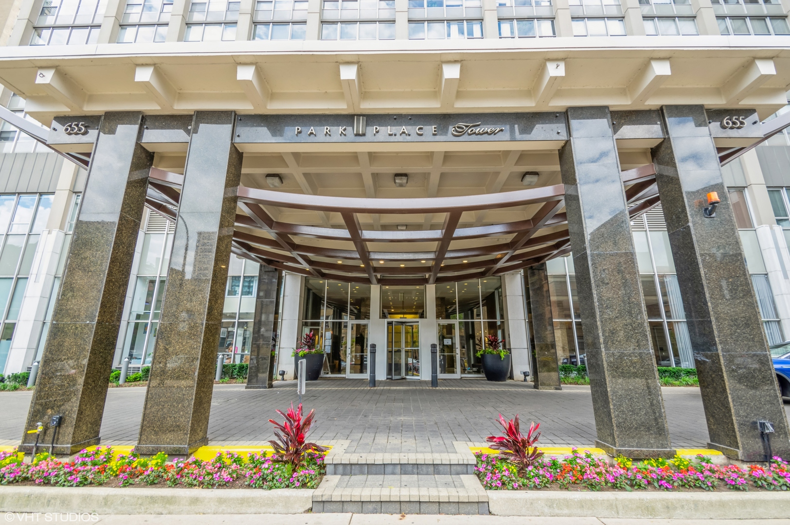 a front view of a building with flowers