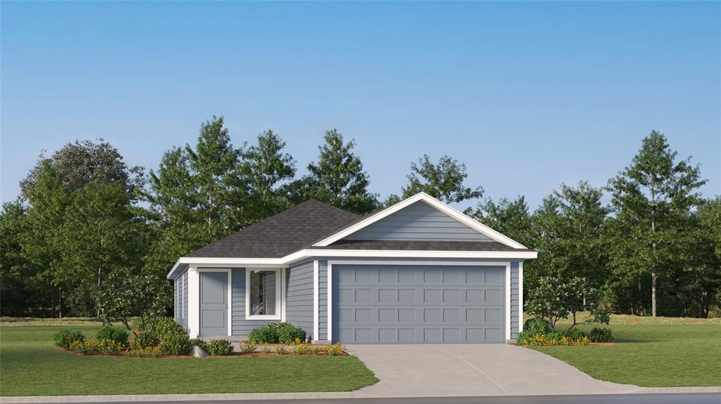 a front view of a house with a yard and trees