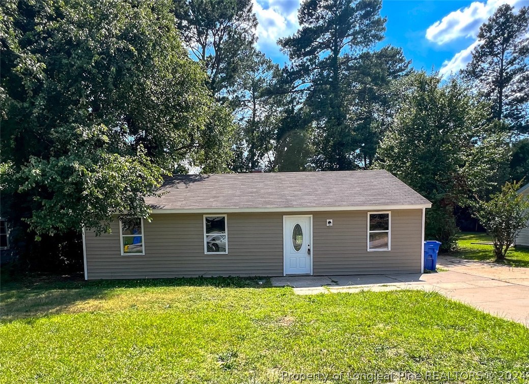 a front view of a house with yard