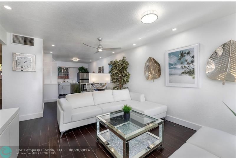 a living room with furniture and a clock