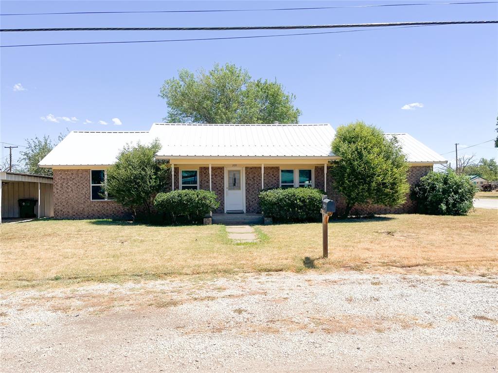 a view of a house with a road