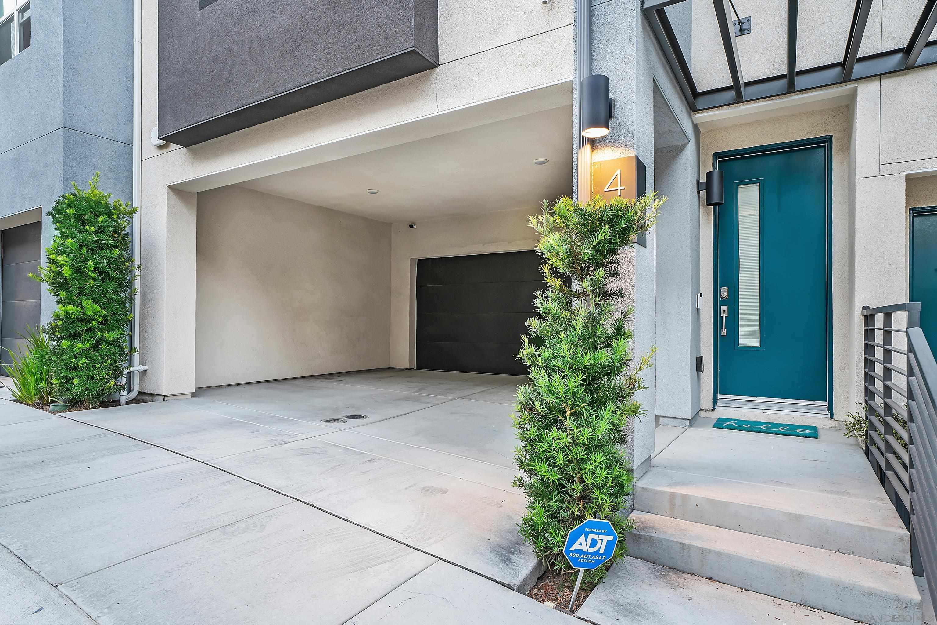 a potted plant sitting in front of a building