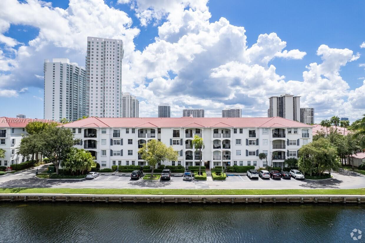 a view of a lake with a large building