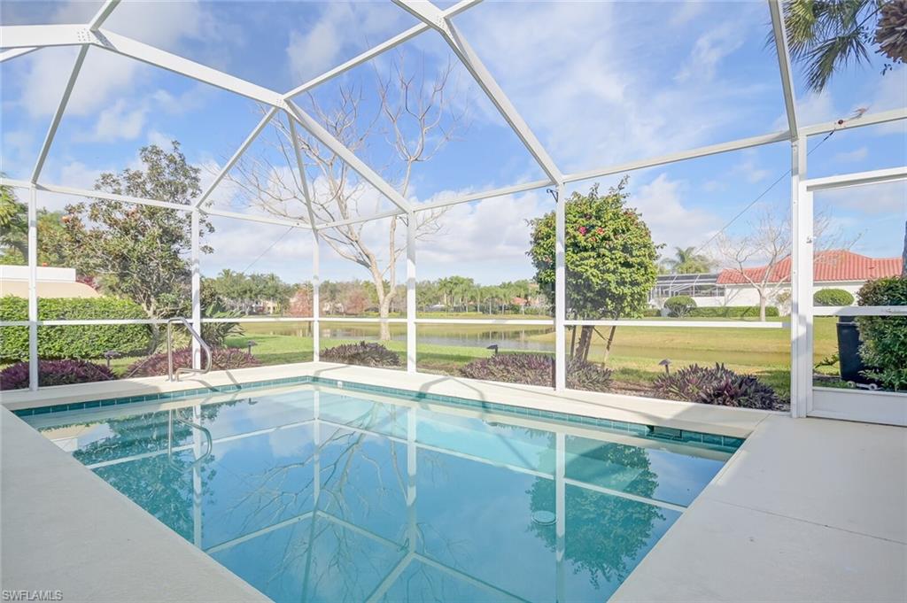 a view of a balcony with yard