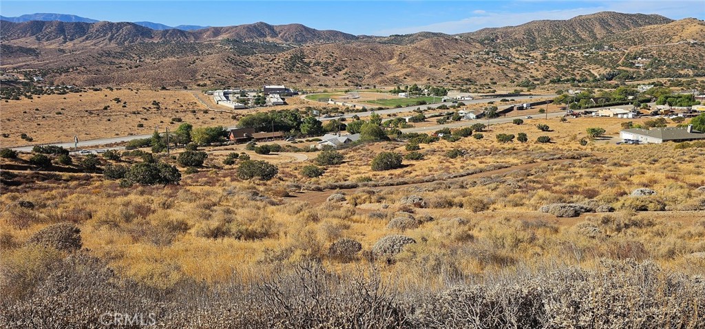 a view of a city with mountains in the background