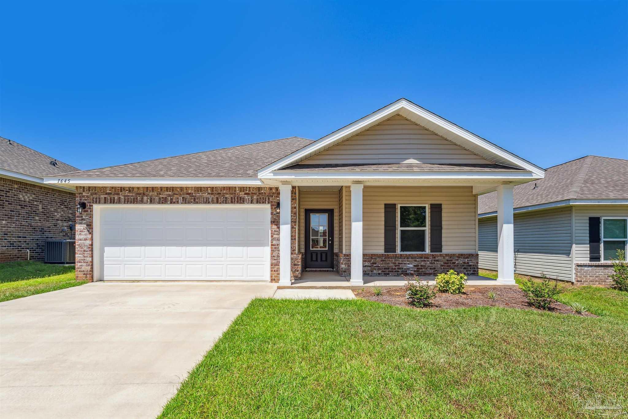 front view of a house with a yard