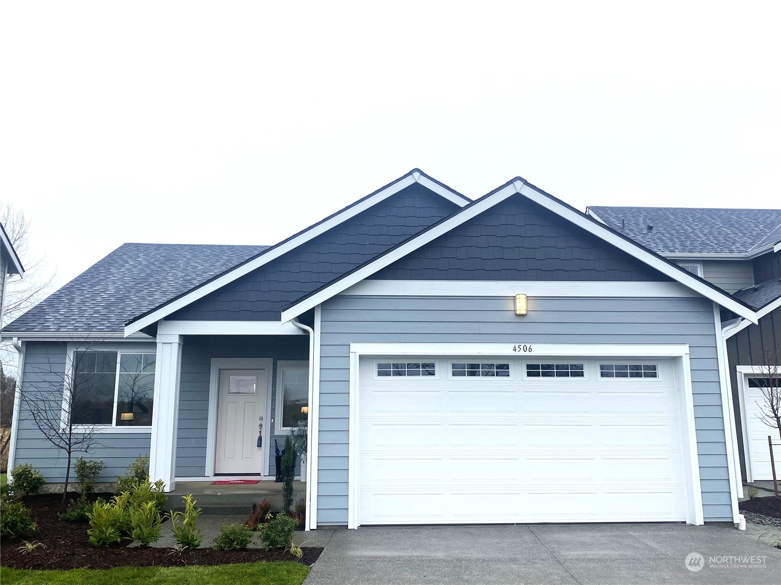 a front view of a house with a garage