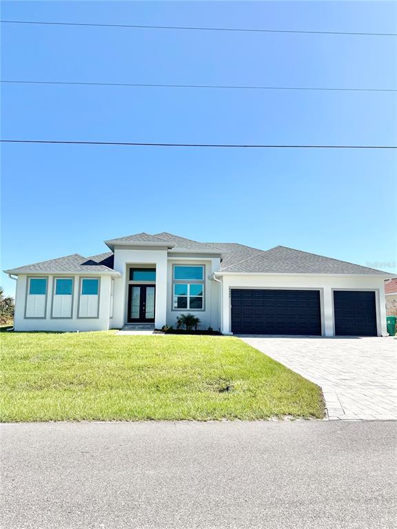 a view of a house with a yard