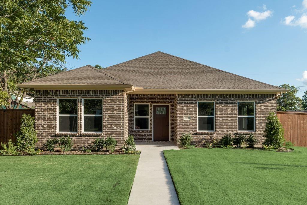 front view of a house with a yard