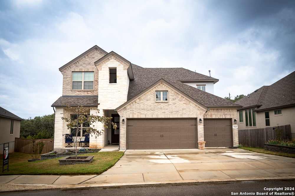 a front view of a house with a yard