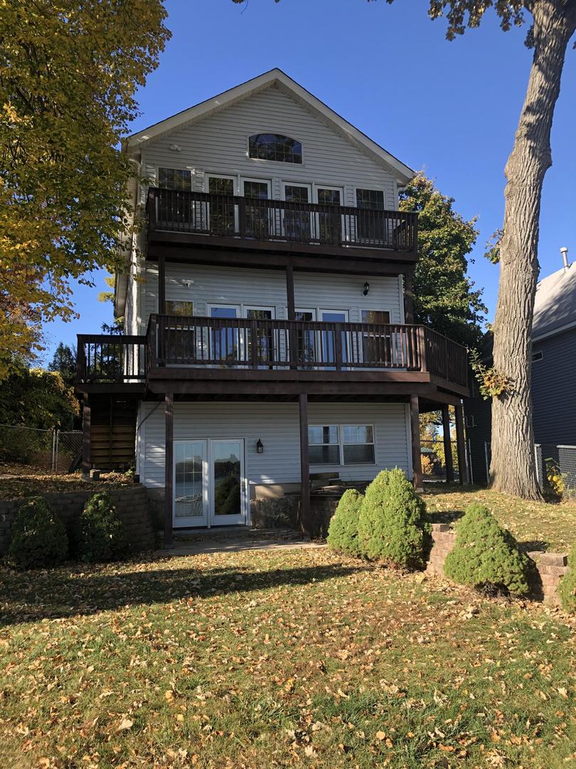 a view of a house next to a yard