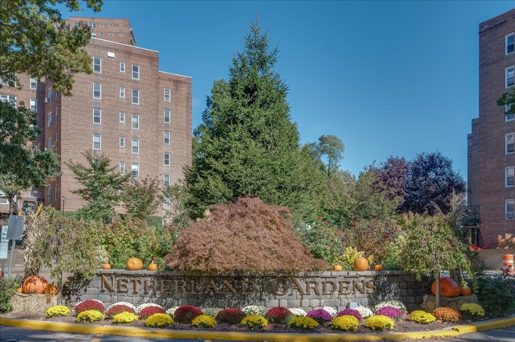 front view of a large building with a yard