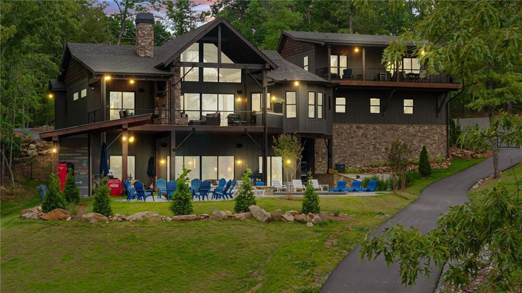 a view of a house with swimming pool and garden