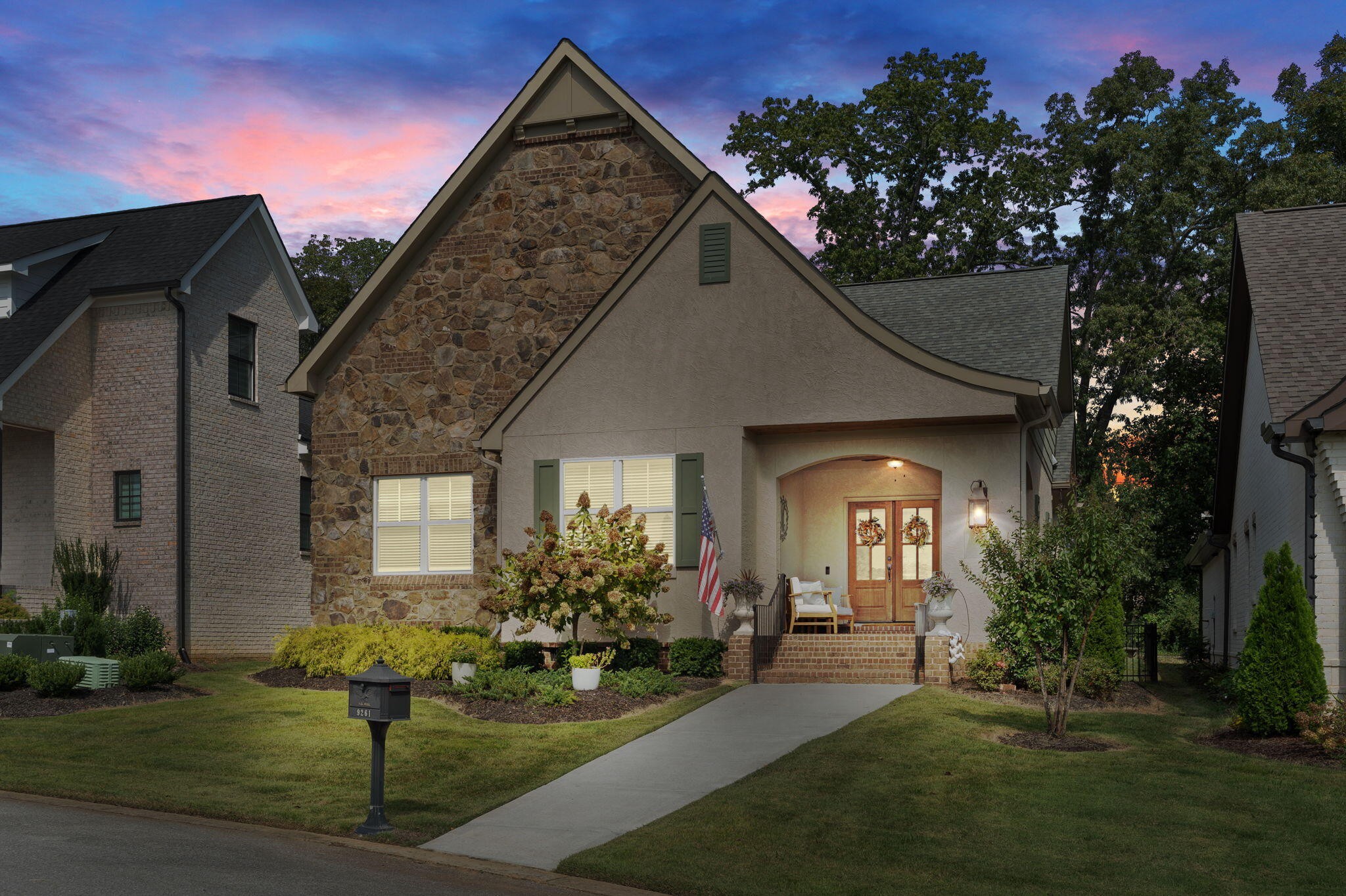 a front view of a house with garden