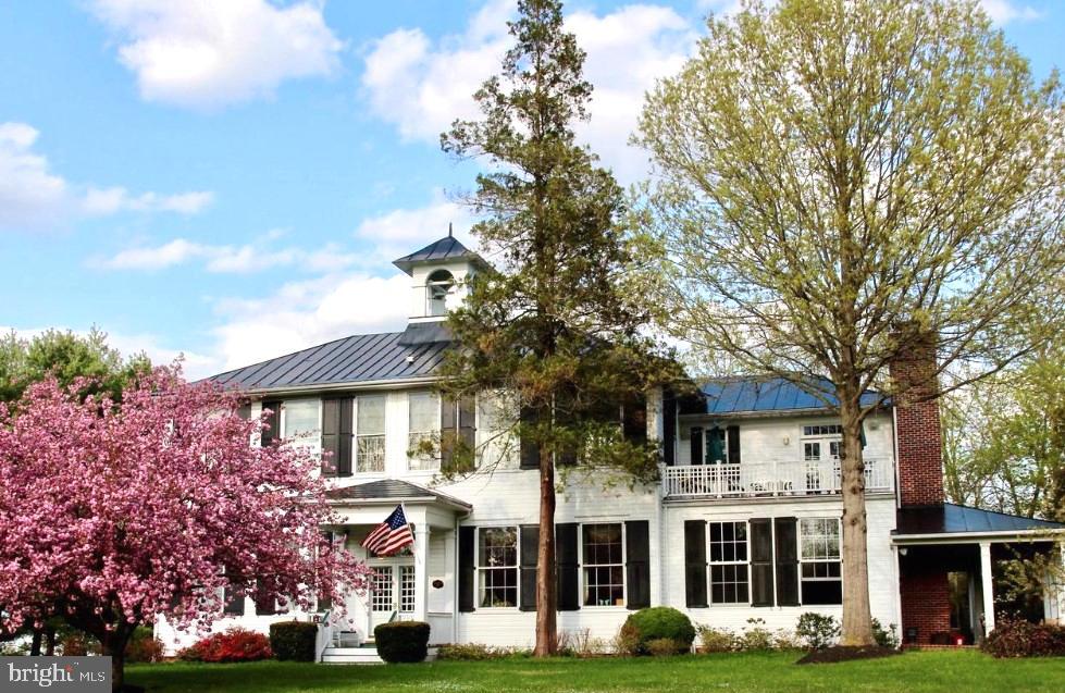 a front view of a building with garden