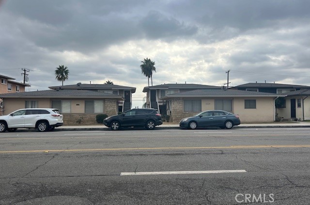 a view of a cars in front of a building