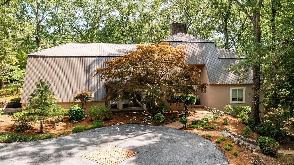 a backyard of a house with lots of green space