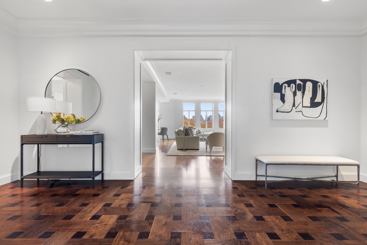 a view of a entryway door and hallway