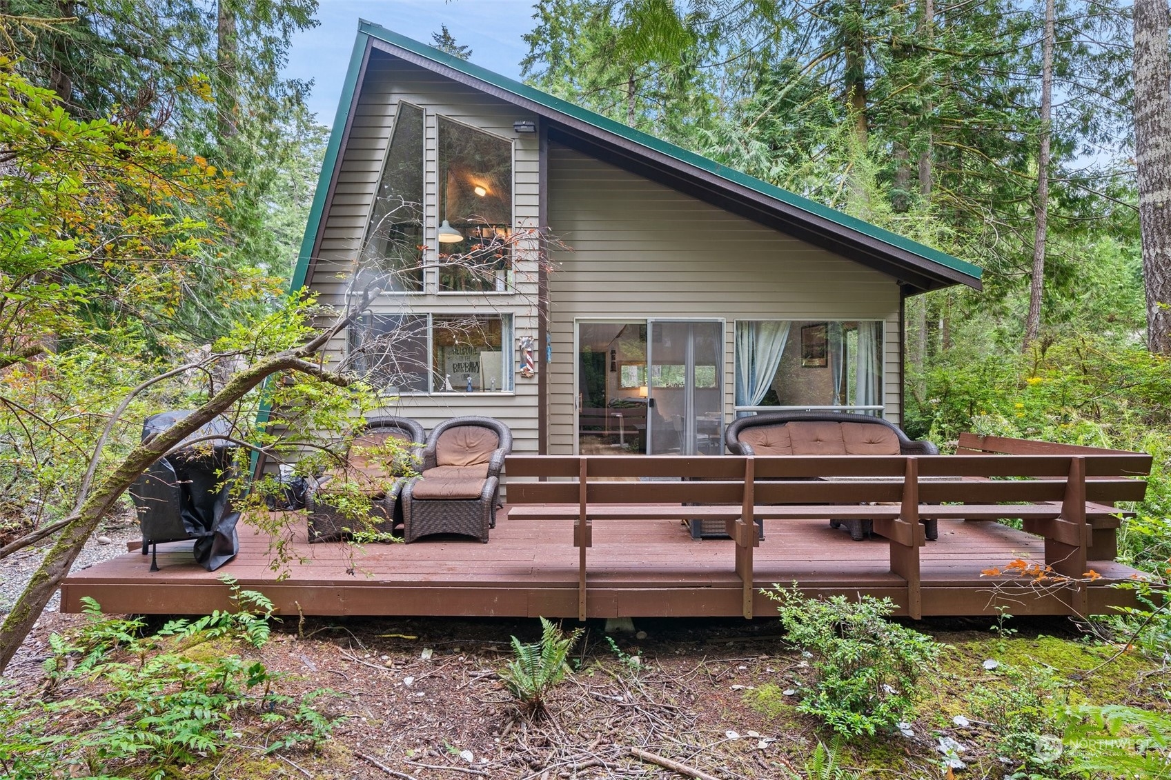 a view of a house with a chairs in patio