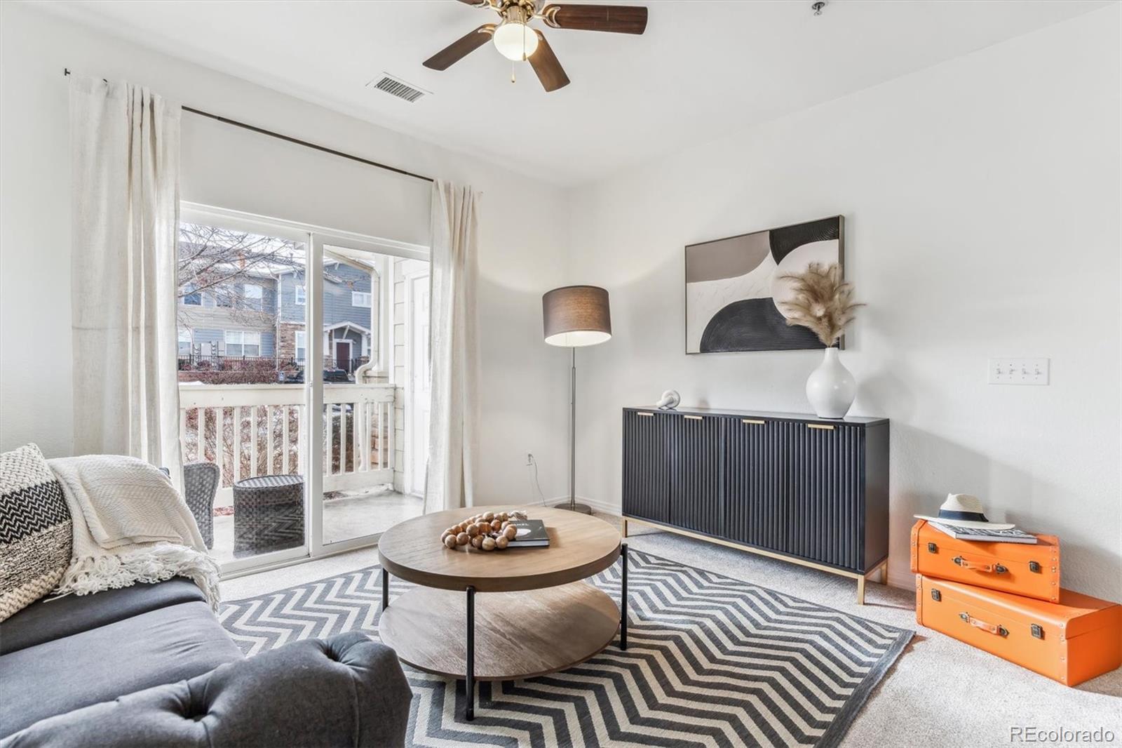 a living room with furniture and a window