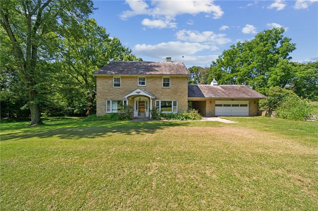 a view of a house with a big yard