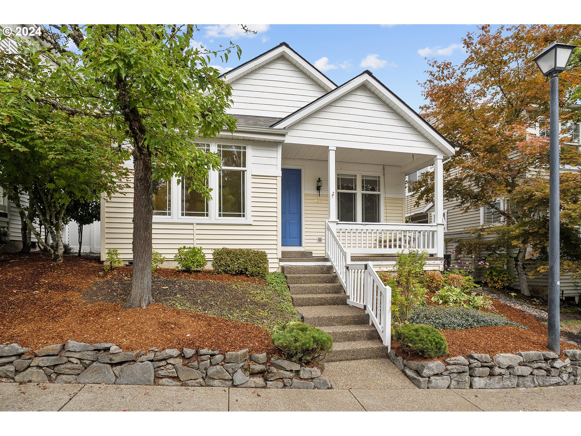 front view of a house with a yard