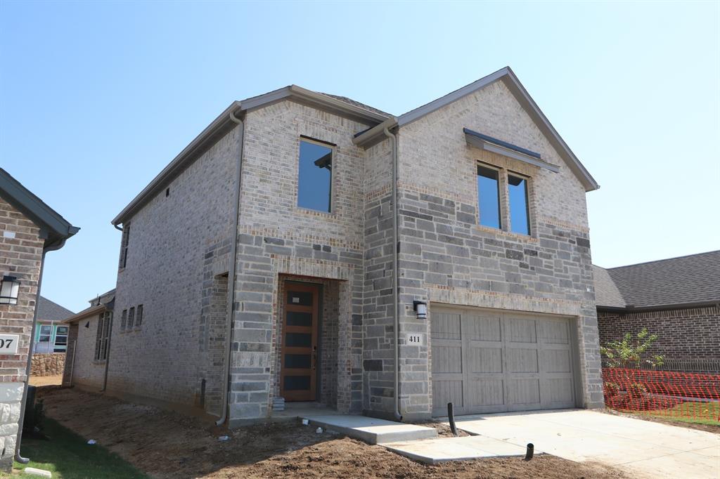 a front view of a house with parking