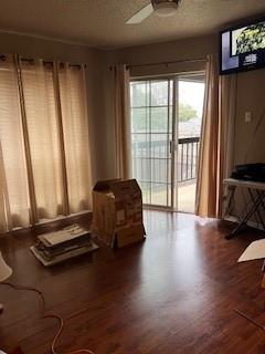 a living room with furniture floor to ceiling window